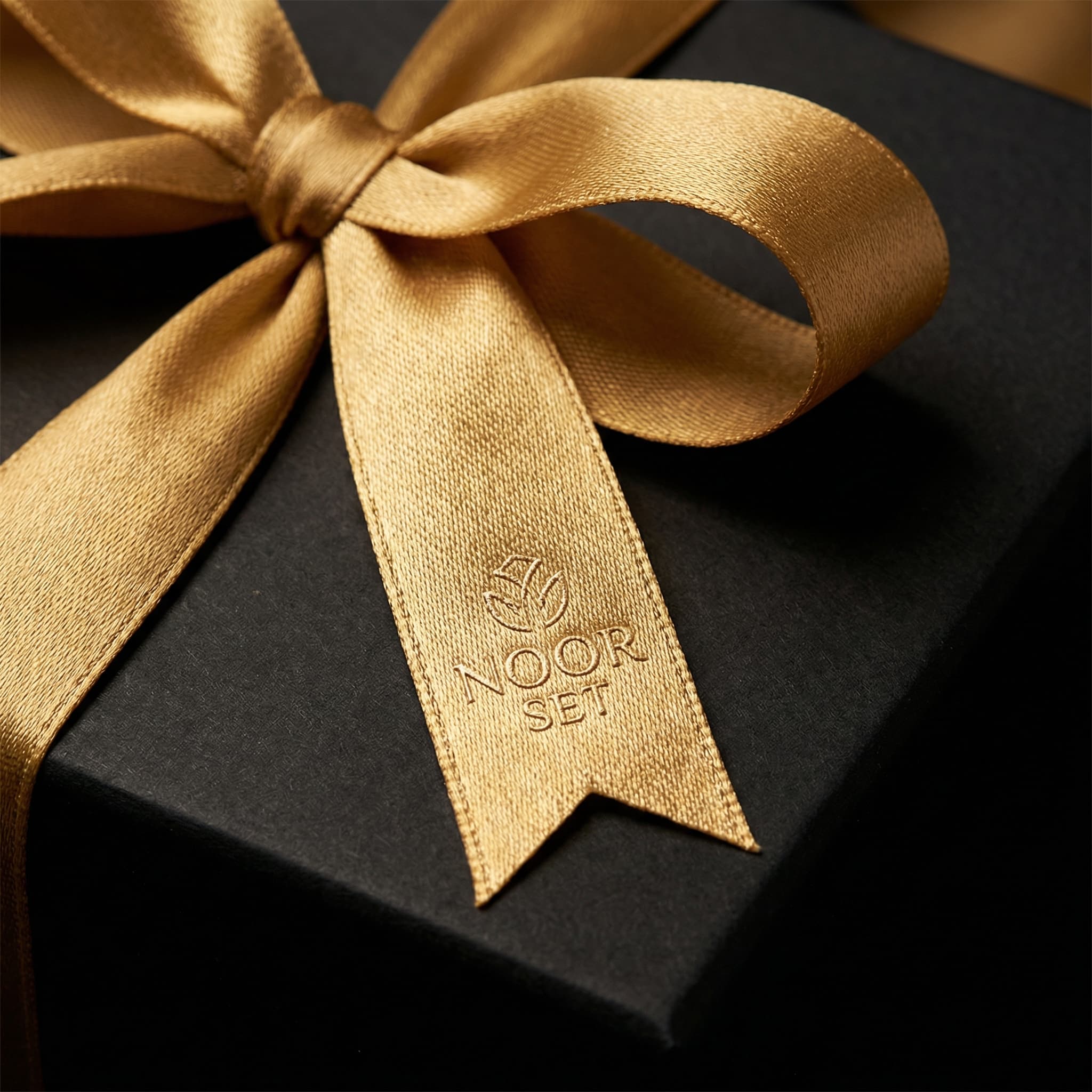 The Noor Set close-up with gold ribbon detail